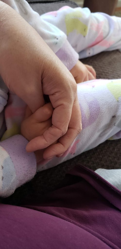 Arley and Dot hold hands