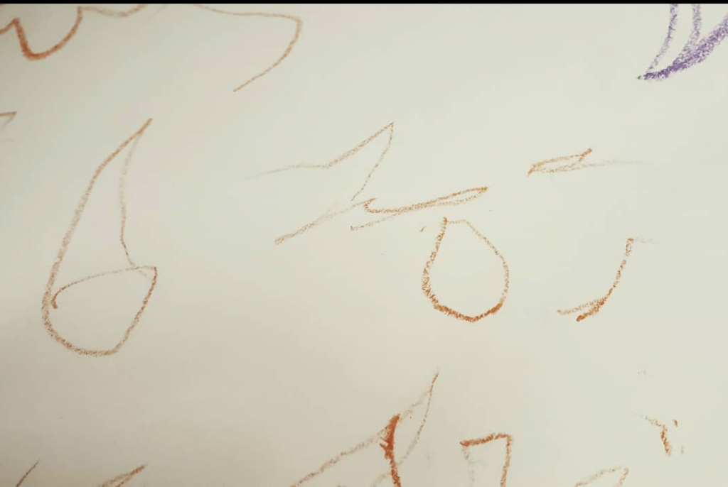 Scribbles that look like D O T
