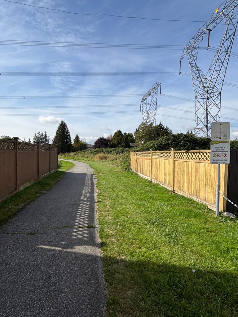 One of the path entrances to the Serpentine Greenway off of 70A and 126th Street (Hayward, 2025)